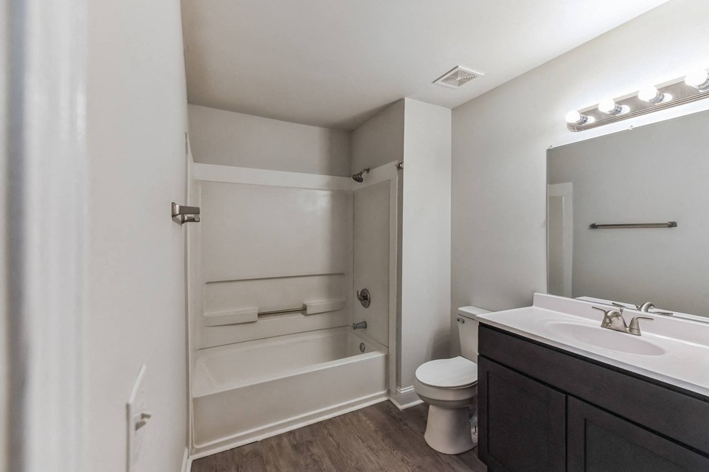 a bathroom with a sink toilet and a shower