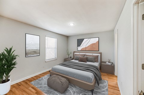 an empty bedroom with a bed and a rug