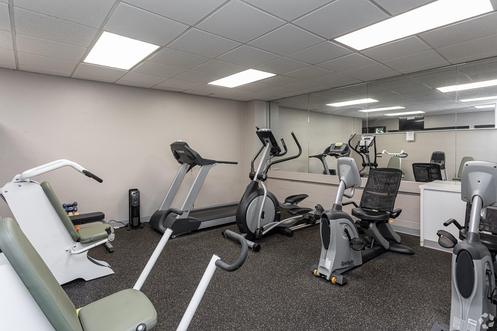 a gym with cardio machines and other exercise equipment