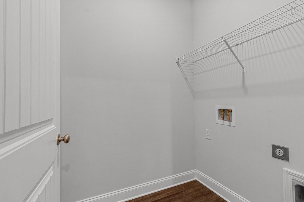 a bedroom with grey walls and a white door