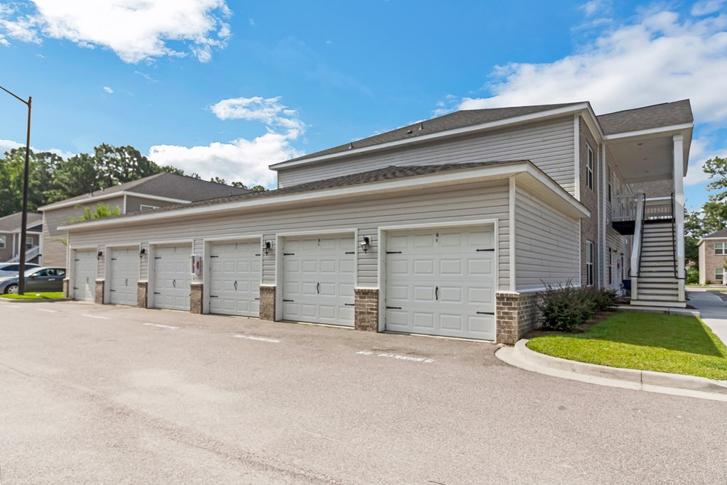 a house with a garage on the side of a road