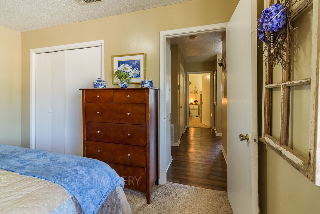 a bedroom with a bed and a dresser
