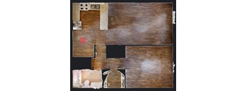 A room with a wooden floor and a white wall with a hole in it.