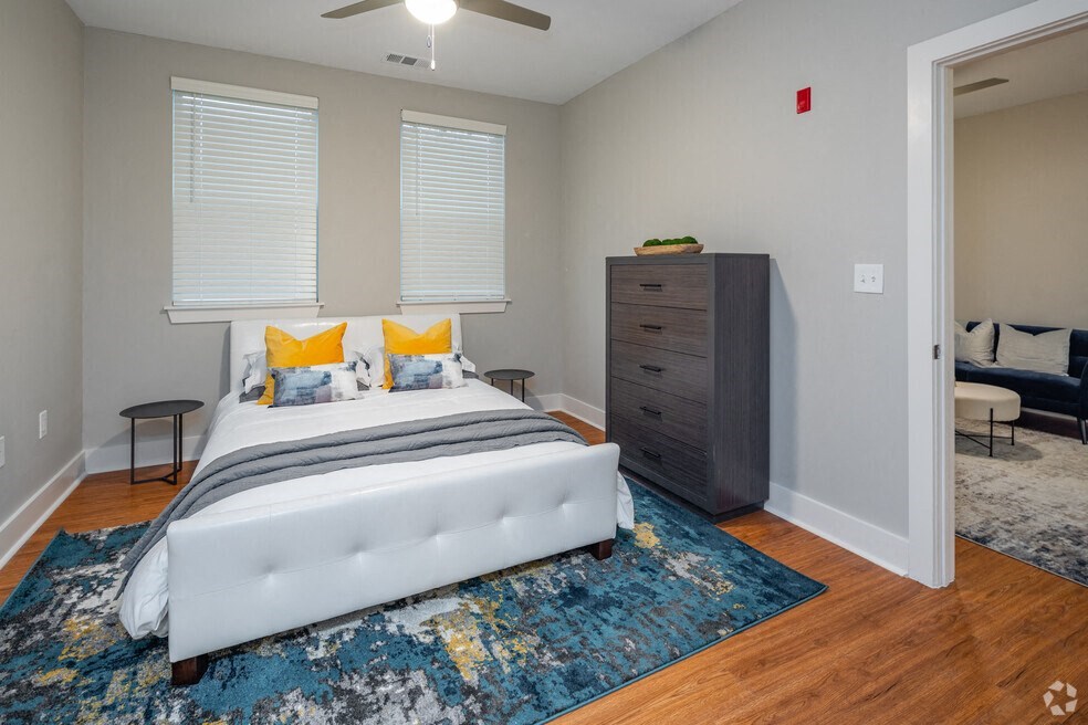 a bedroom with a bed and a dresser