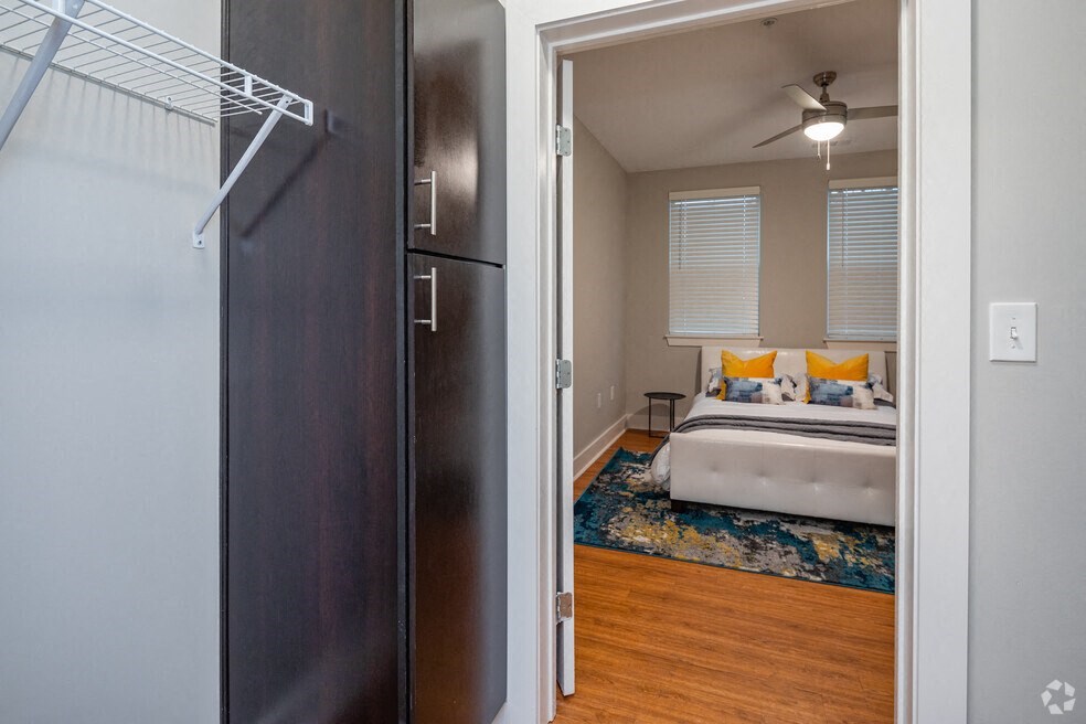 a bedroom with a bed and a closet