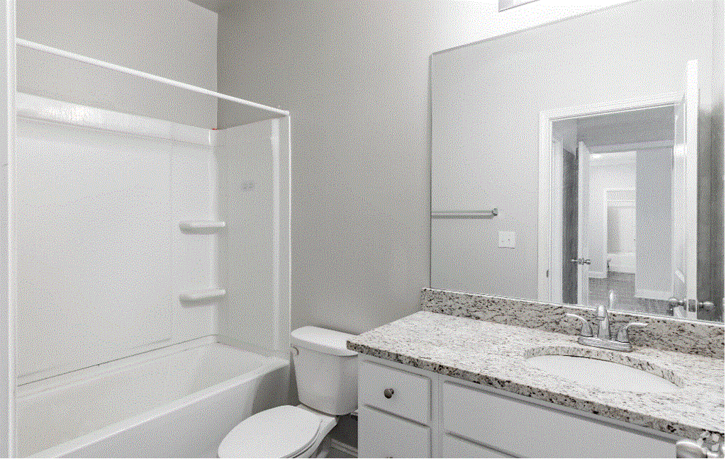 a bathroom with a toilet sink and bathtub