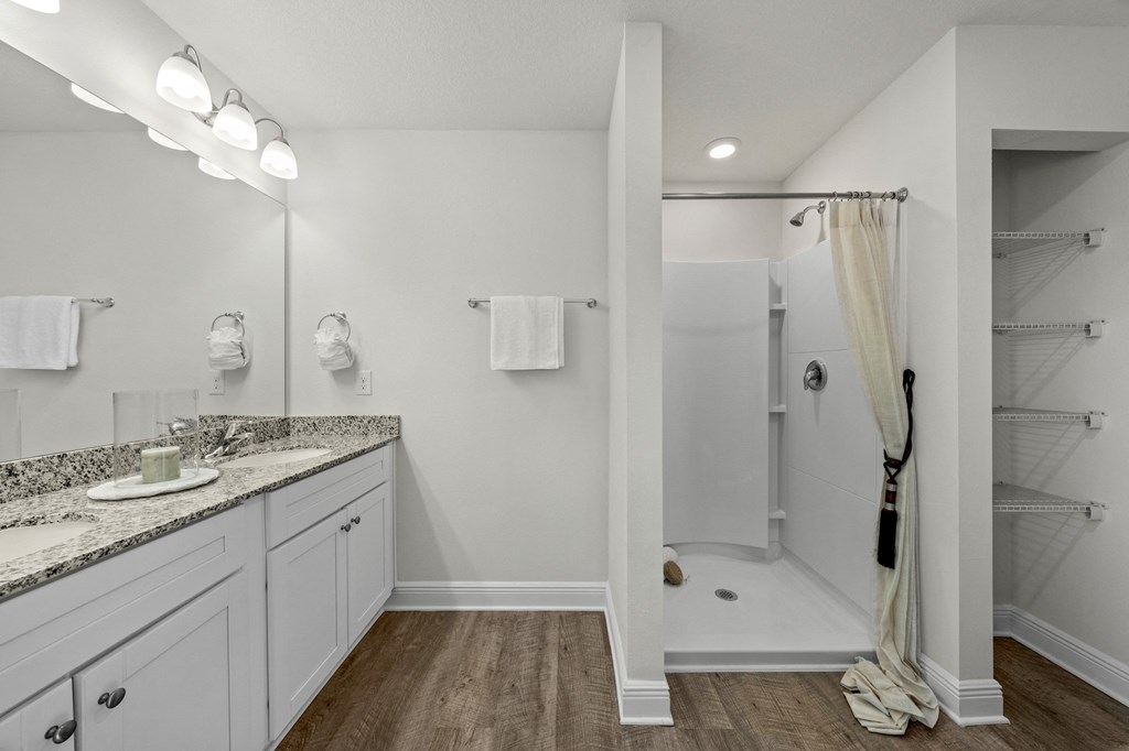 a bathroom with a shower and a sink