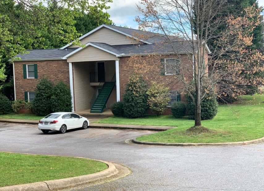 a house with a car parked in front of it