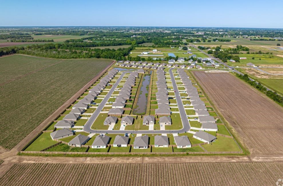 an aerial view of a parking lot of houses