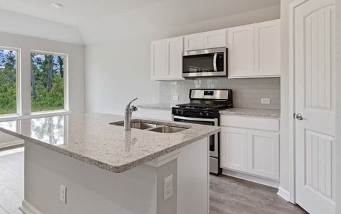 a kitchen with a counter top and a sink