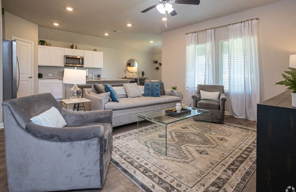 a living room with couches and a table