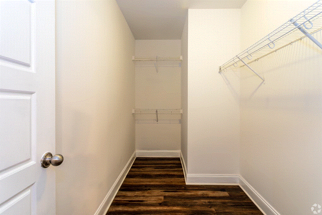 a walk in closet in a 555 waverly unit
