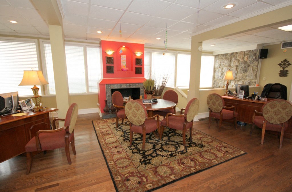 a dining room with a table and chairs and a fireplace