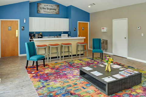 A room with a blue wall and a white counter.