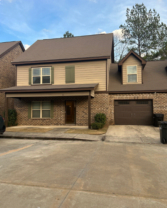 a house with a drive way in front of it