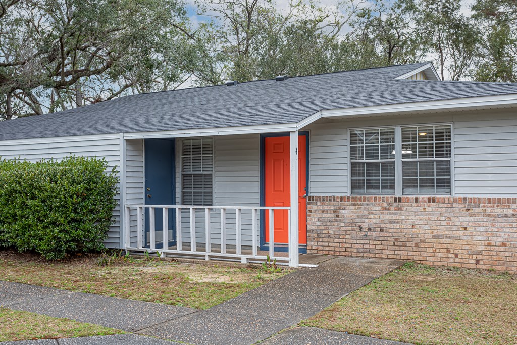 a house with a red door and a blue door