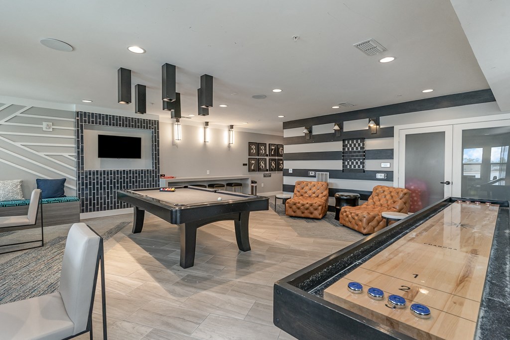 a games room with a ping pong table and a foosball table