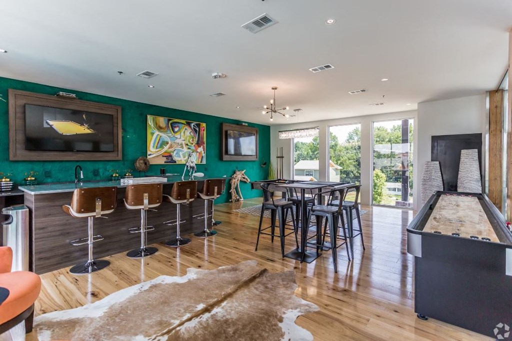 a game room with a pool table and a foosball table