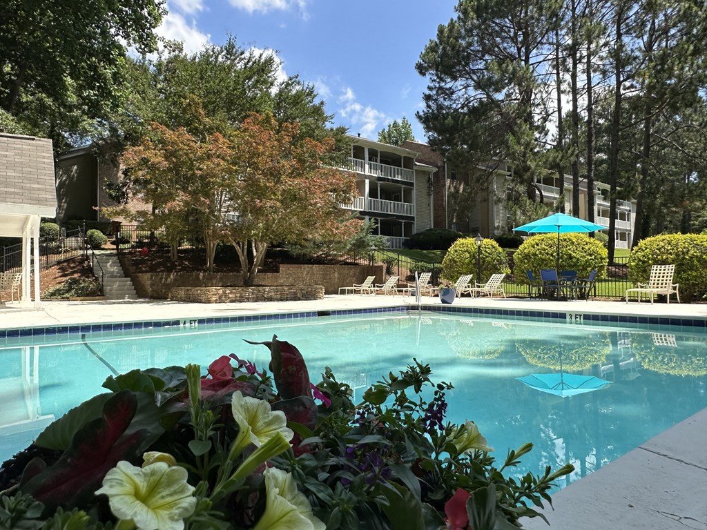 a swimming pool with a building in the background