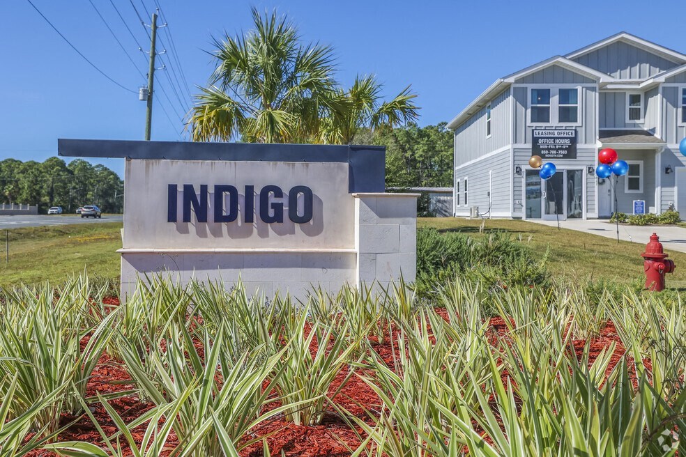 our sign in front of our house with a red fire hydrant