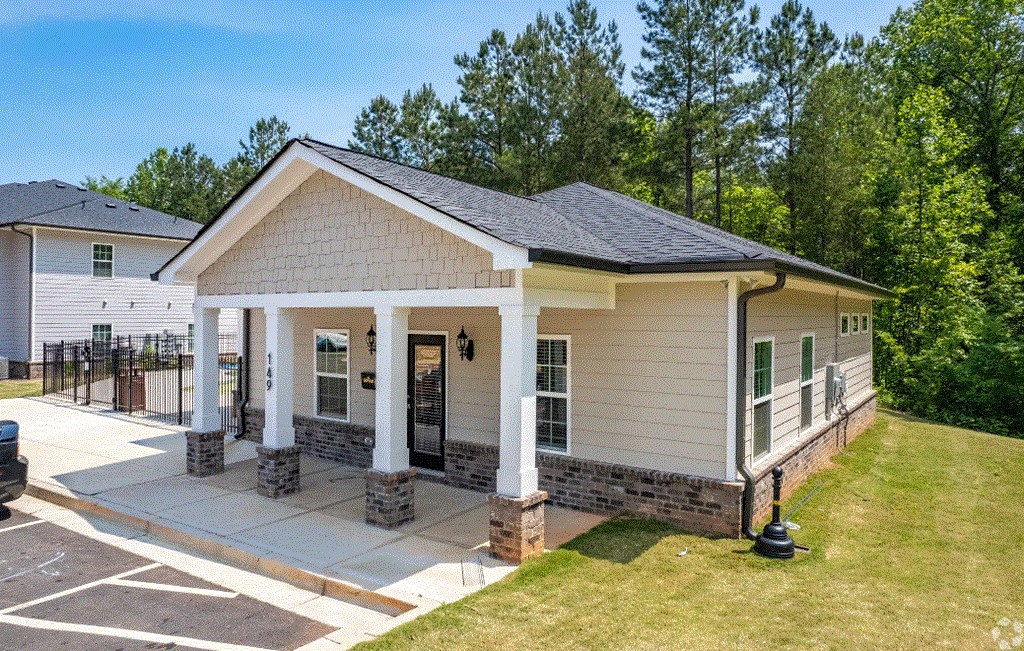a house with a porch and a carport