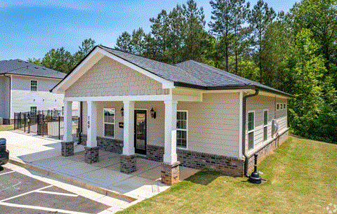 a house with a porch and a carport