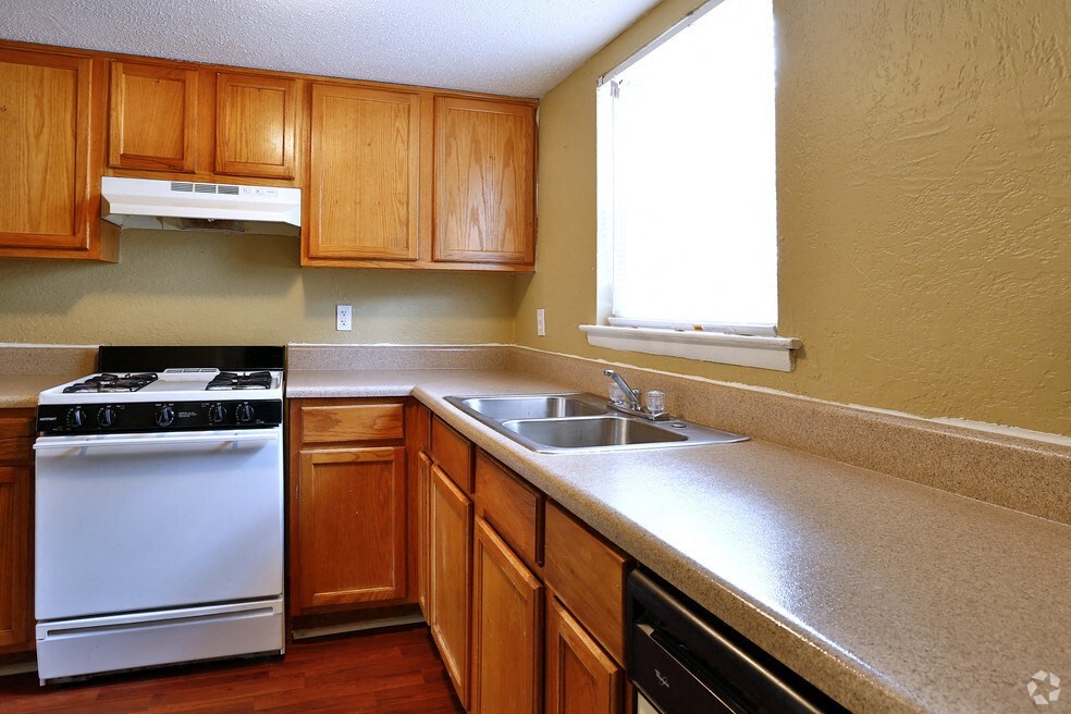 a kitchen with a stove and a sink