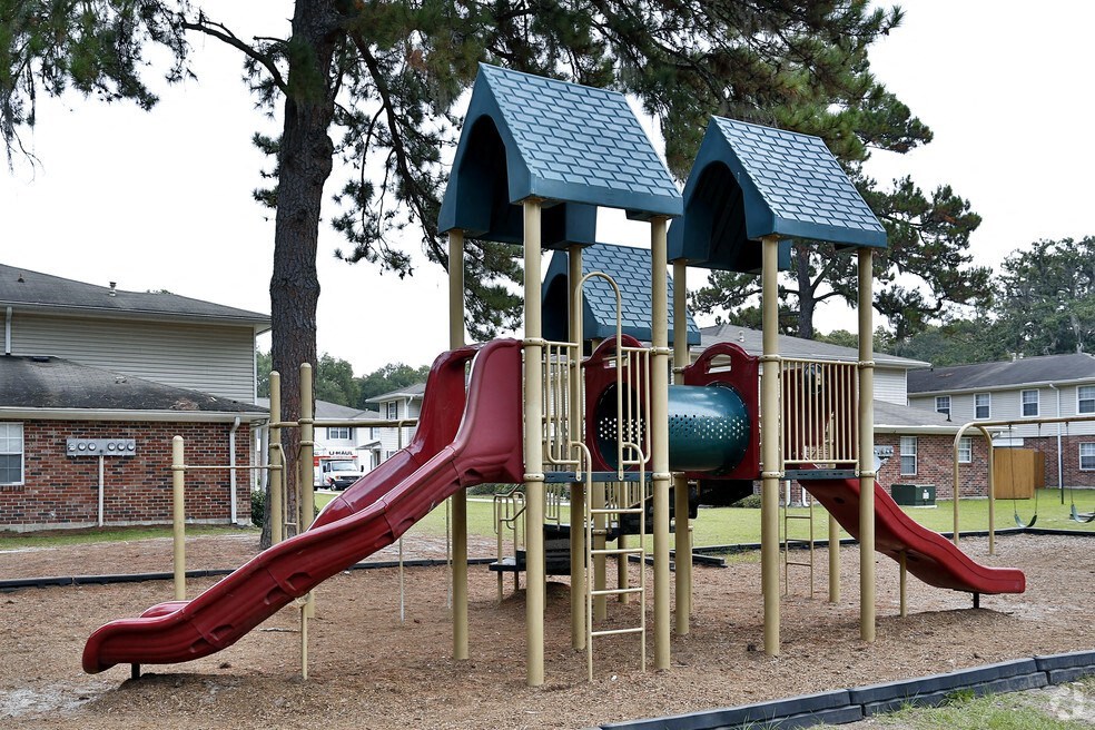 a playground with a slide and other playground equipment