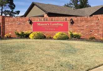 a red brick building with a sign for masons landing