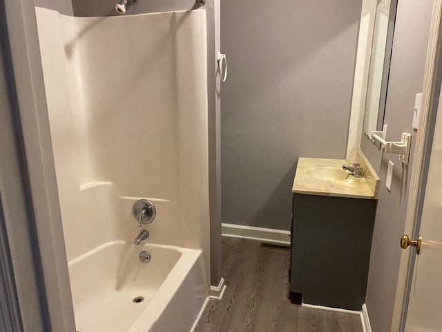 a bathroom with a bathtub and a sink