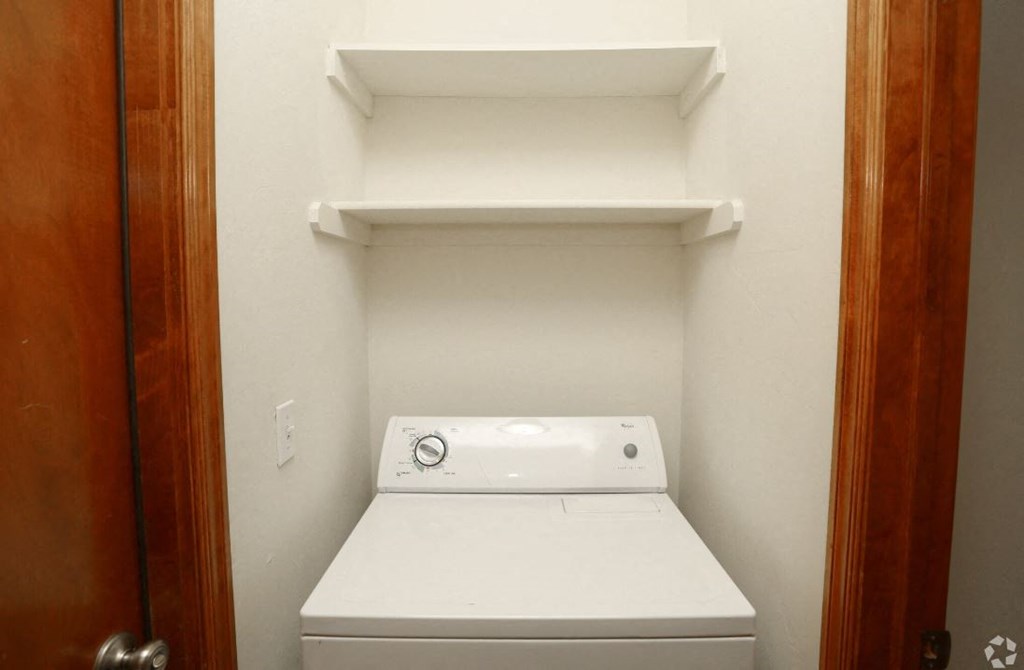 a washer and dryer in a small laundry room
