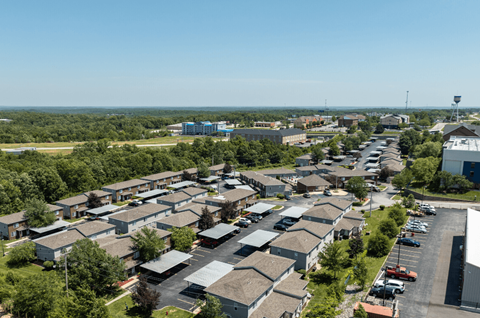 an aerial view of a neighborhood with many houses and trees