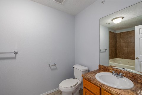 a bathroom with a sink toilet and bathtub