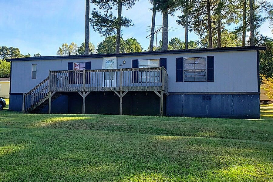 a house with a large yard in front of it