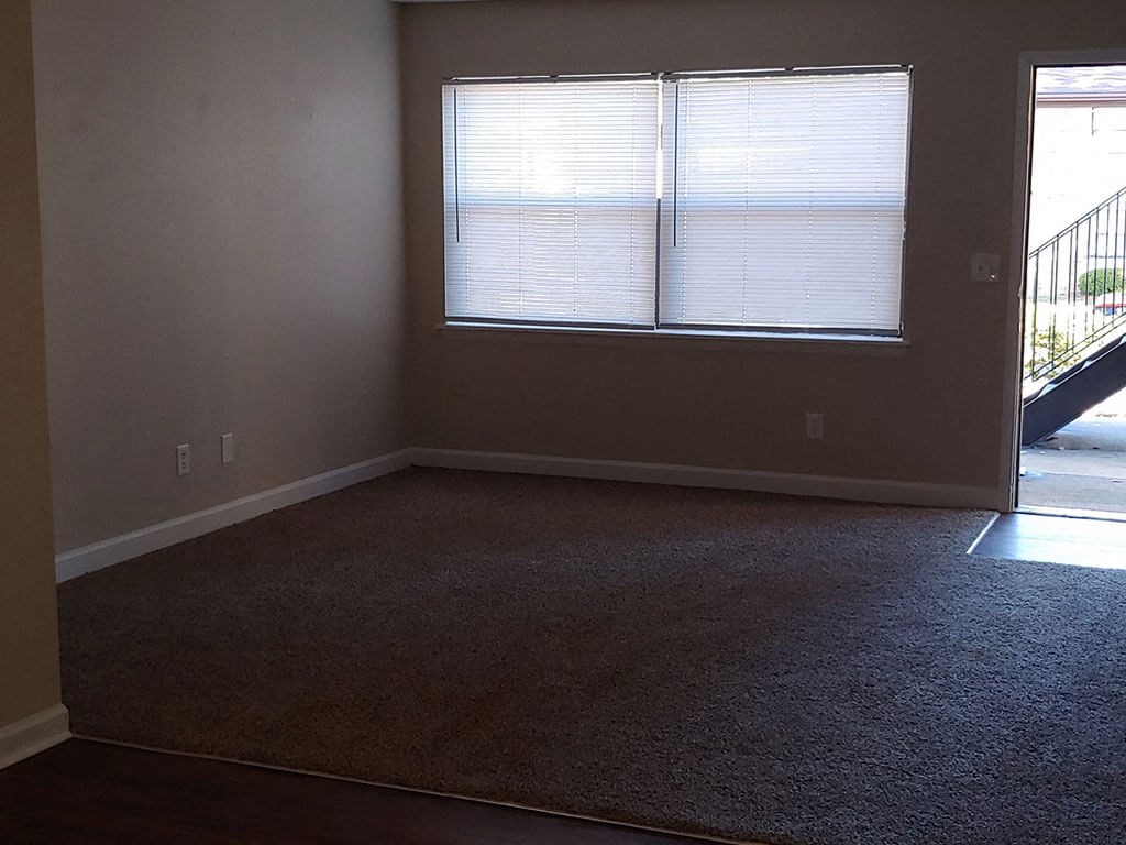an empty room with a large window