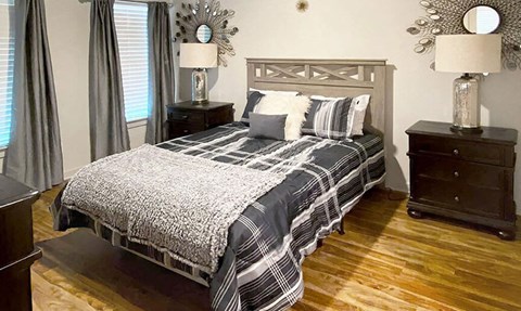 a bedroom with a bed and two night stands