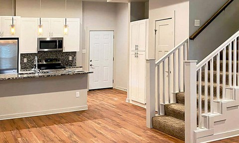 A kitchen with a stove top oven and a counter top.