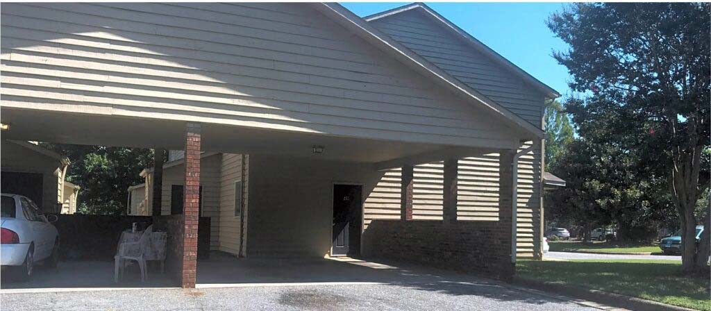 a house with a car parked in front of it