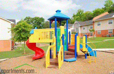 a playground with a slide and monkey bars