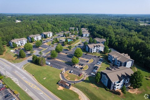 an aerial view of a neighborhood with houses and roads