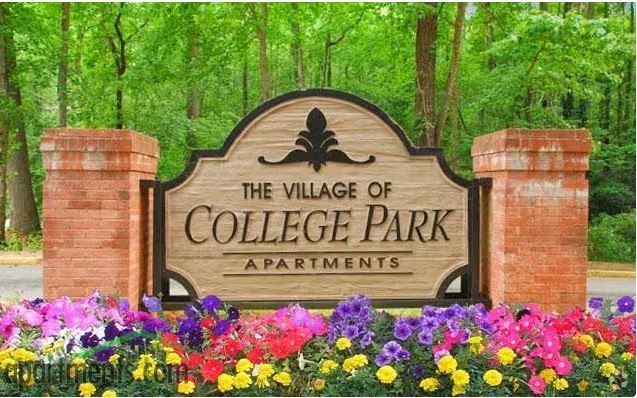 a sign for the village of college park apartments