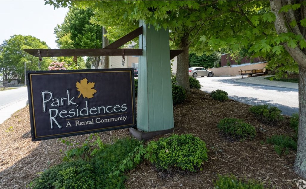 a park residents sign in front of a building
