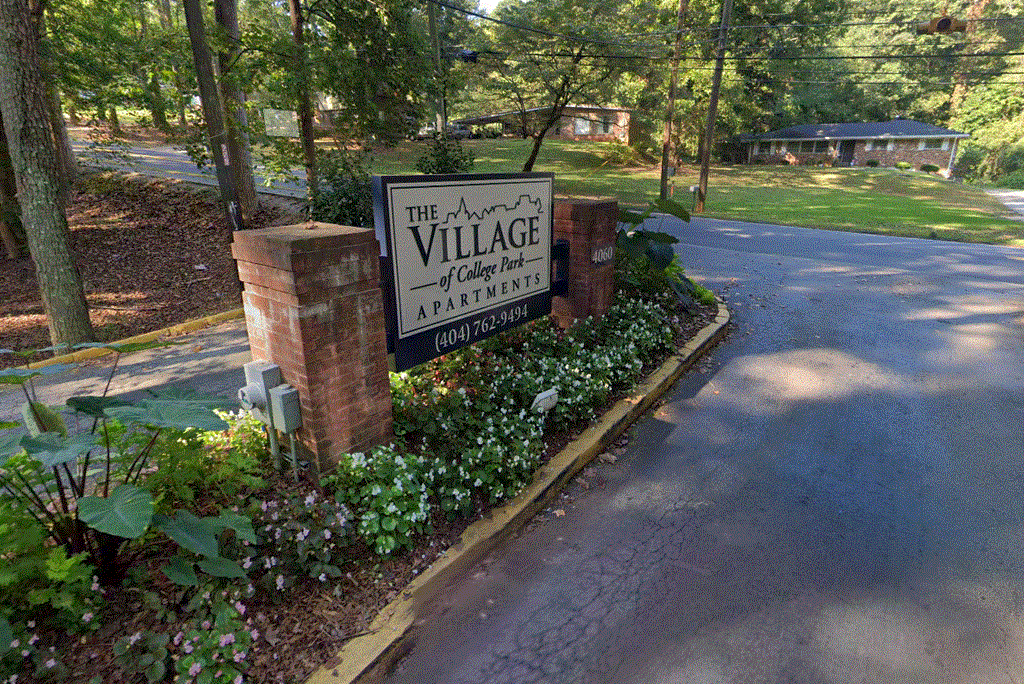 a view of the village sign from the street