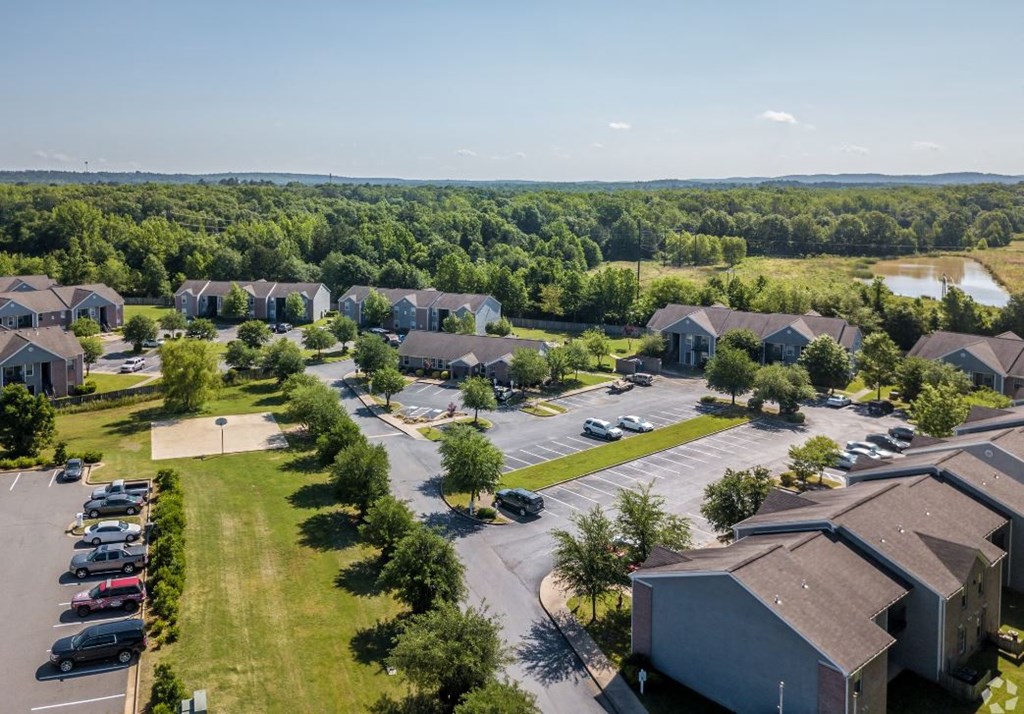 an aerial view of a neighborhood with houses and cars parked