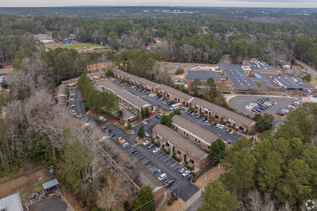an aerial view of the parking lot of a building in a parking lot