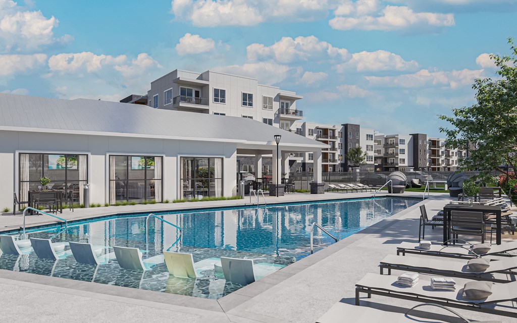 a swimming pool with lounge chairs and buildings in the background