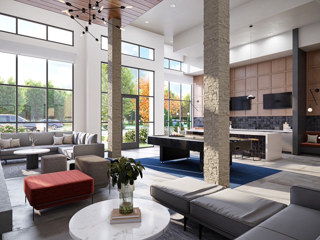 a large living room with couches and tables and a fireplace