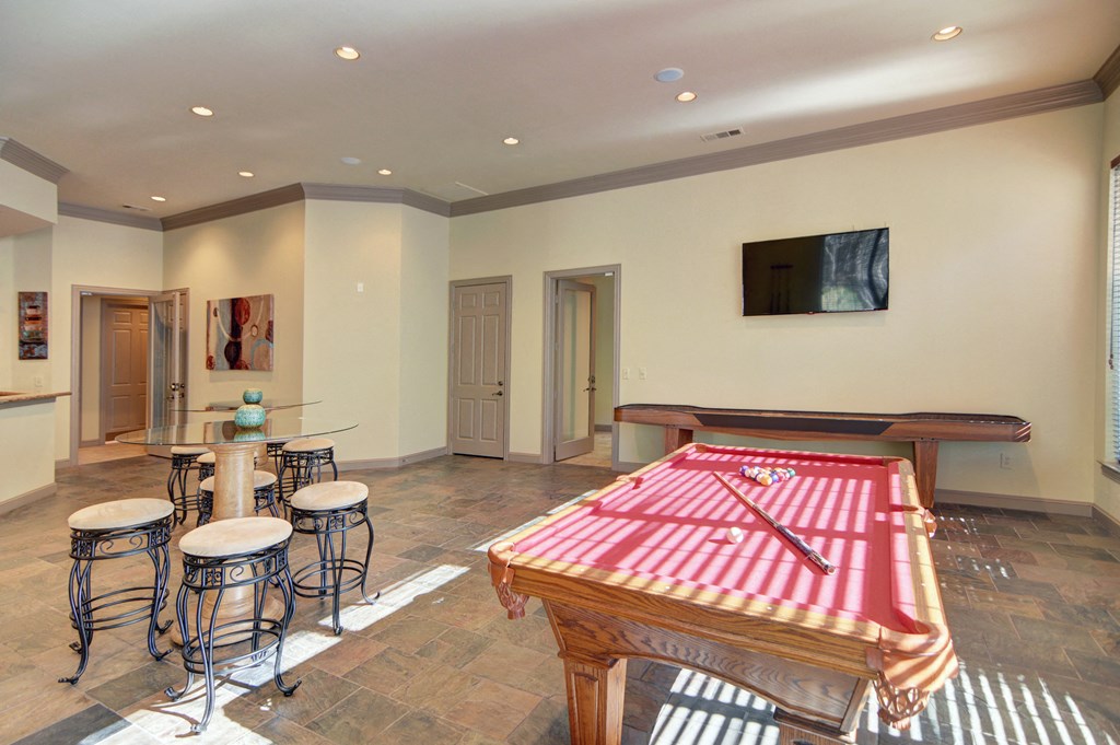 Clubhouse pool table and shuffleboard  at Clearwater Creek, Richardson, 75082