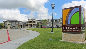 Front sign by curb - Photo Gallery 2