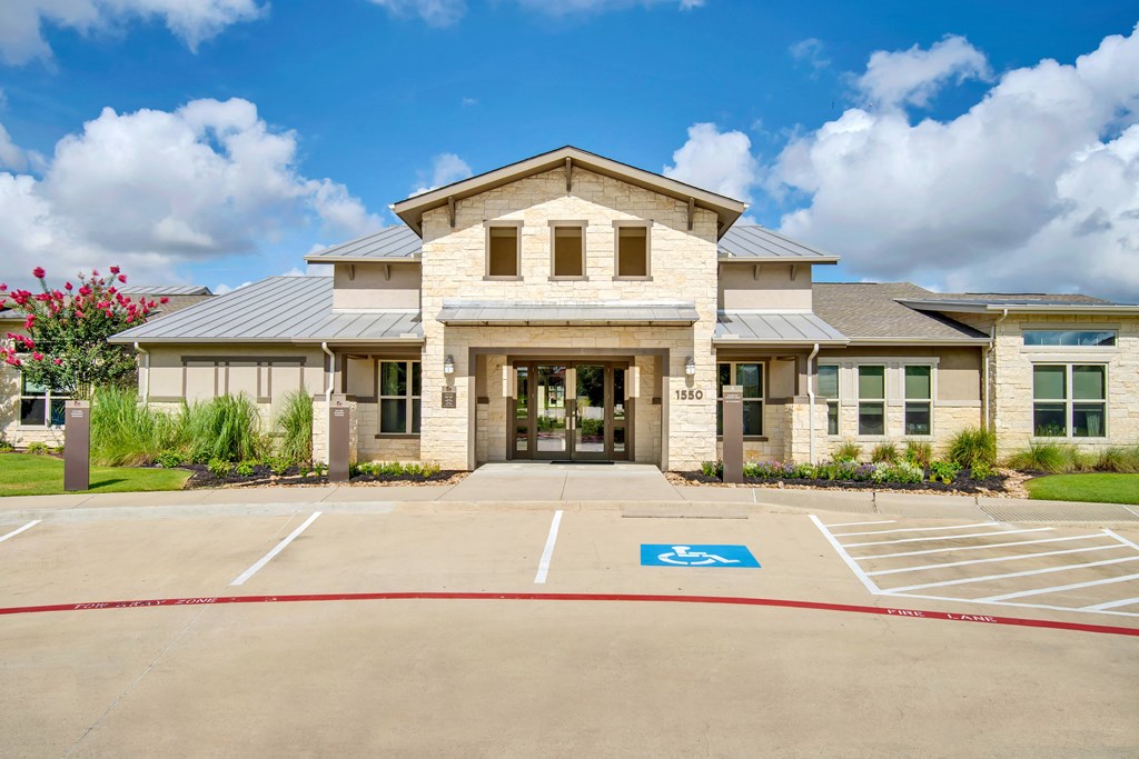 the preserve at ballantyne commons community entrance with parking lot and building